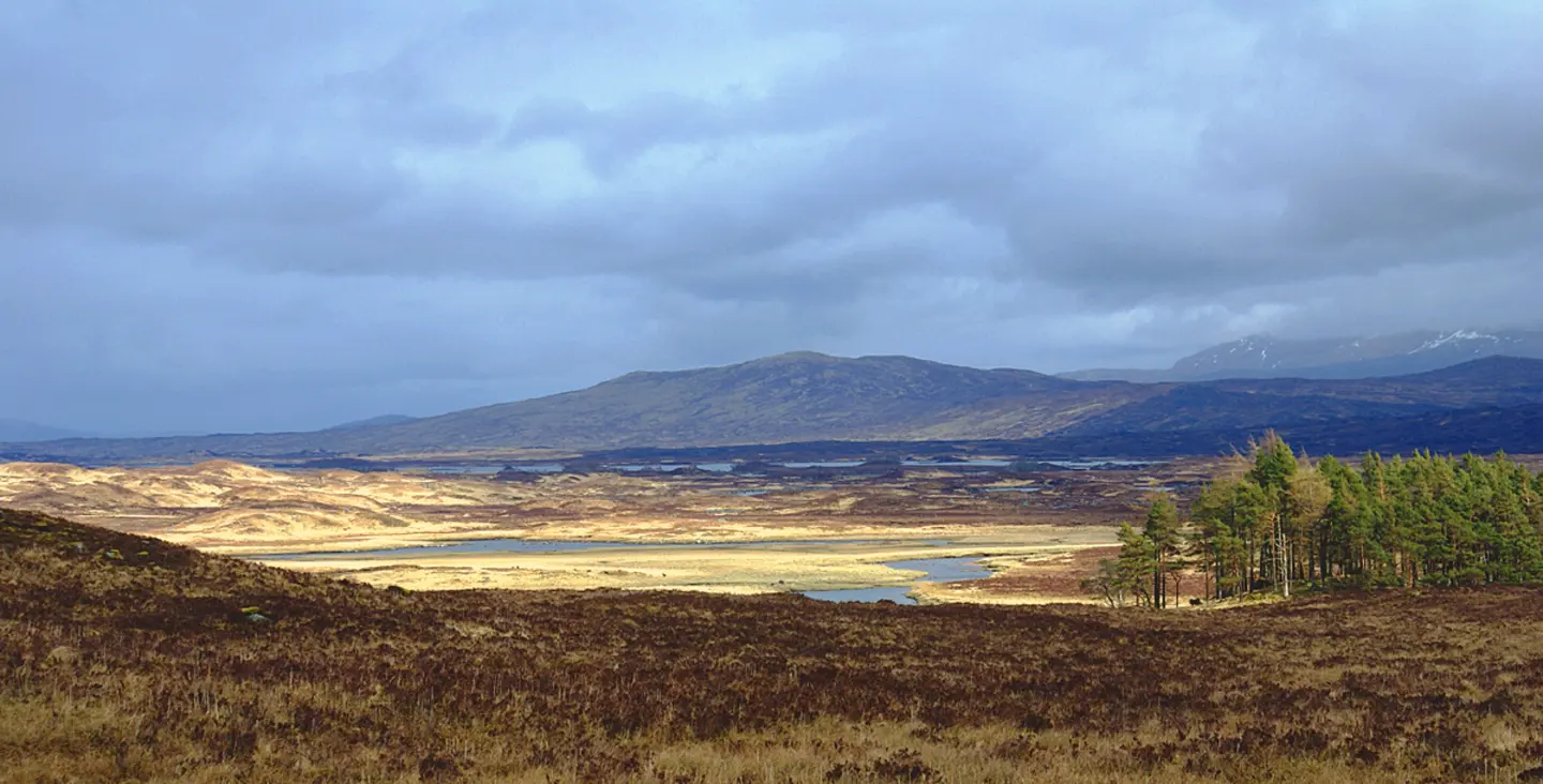 Sun breaking through cloud on Rannoch Moor on the West Highland Way between Bridge of Orchy and Kingshouse